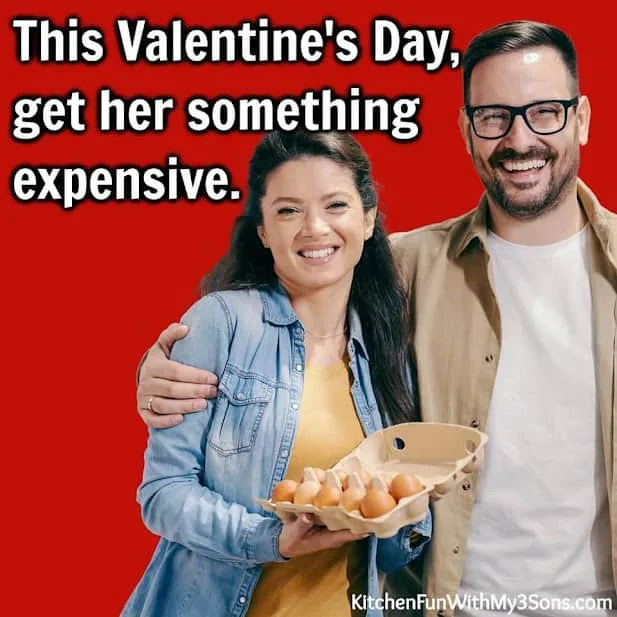 A smiling man and woman stand close together against a solid red background. The woman, wearing a denim jacket over a yellow…