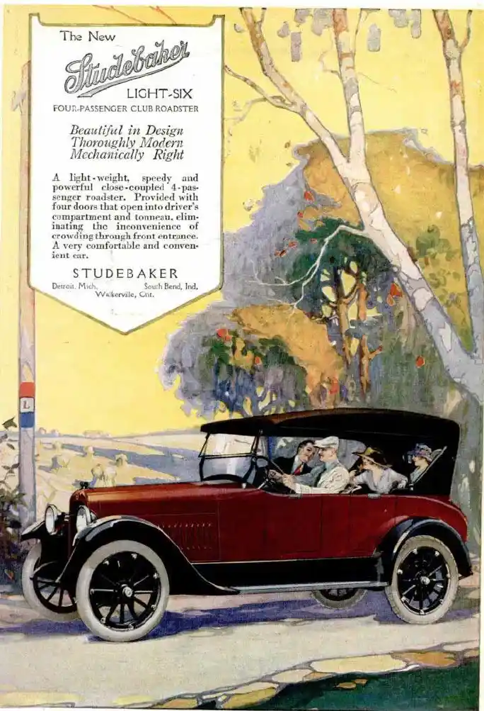 An early 20th-century vintage advertisement for the Studebaker Light-Six automobile, featuring a red four-passenger roadster…