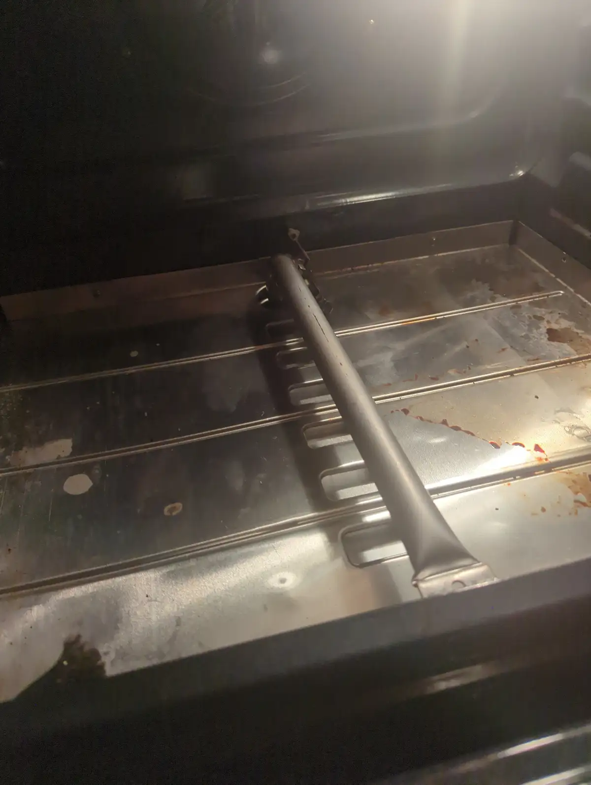 An Old Oven and Its Trusty Ignitor: A Nostalgic Pair