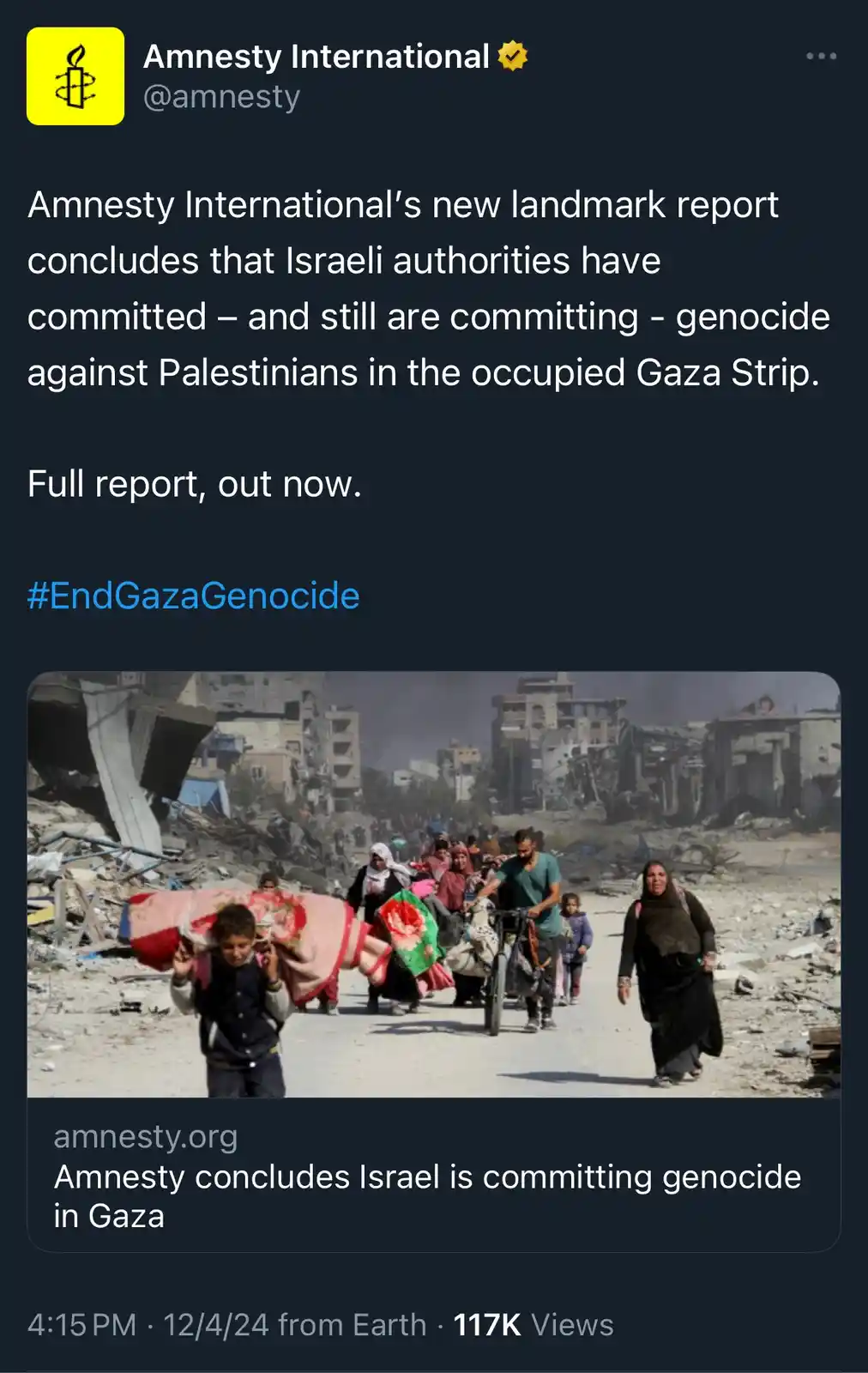 A screenshot of an Amnesty International tweet featuring a photo of displaced Palestinians walking through rubble-strewn…
