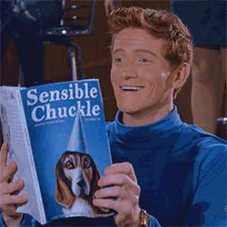 A man in a blue turtleneck holds a magazine titled 'Sensible Chuckle' featuring a beagle wearing a party hat. The sequence…