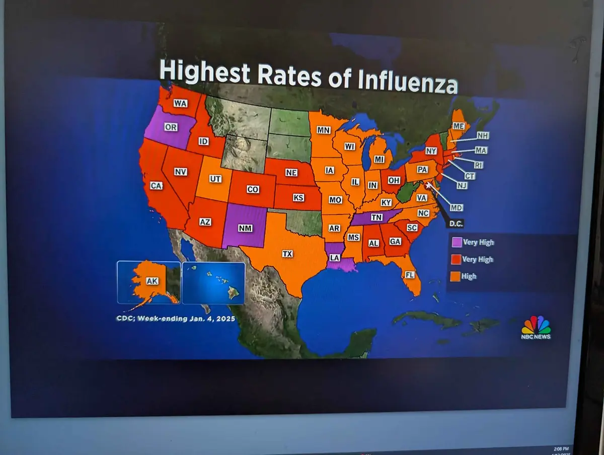 A screenshot of an NBC News broadcast showing a color-coded map of the United States titled 'Highest Rates of Influenza,'…