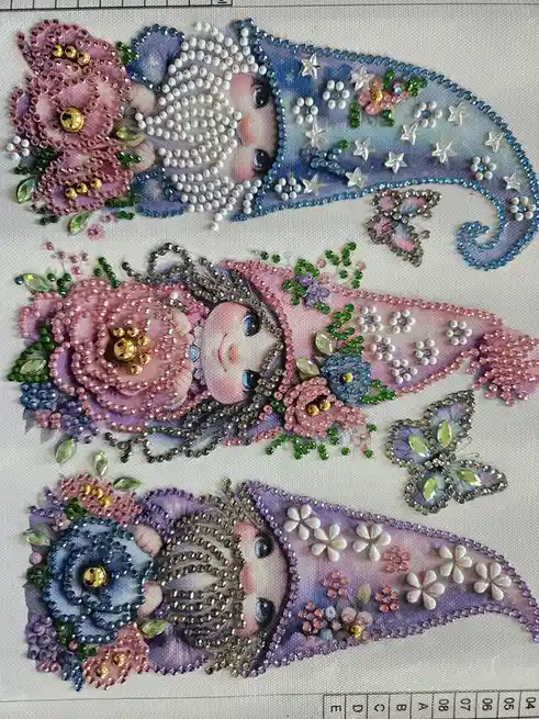 Three identical images of a baby's face are arranged vertically on a canvas, each adorned with elaborate beadwork, sequins…