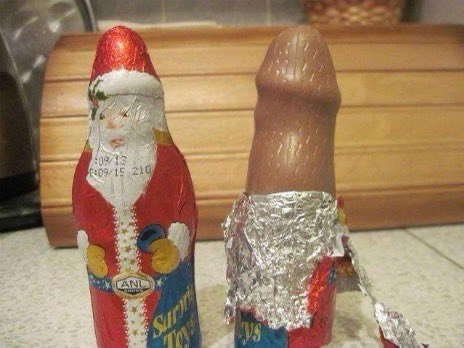Two chocolate bars are shown side by side on a kitchen counter. The left bar is wrapped in red foil shaped like a Santa…