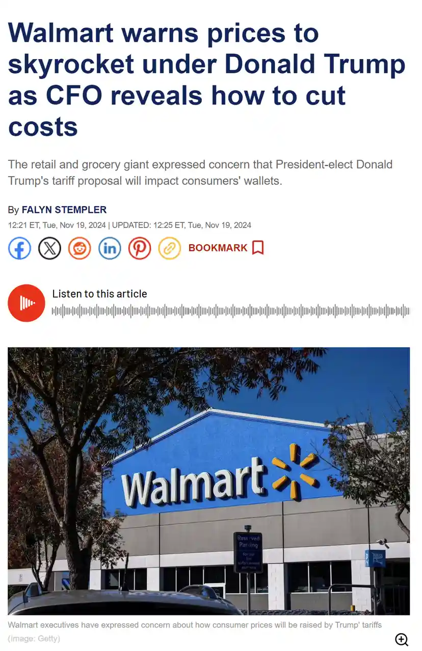 An image of a Walmart store with its iconic blue sign and yellow spark logo, framed by trees under a clear blue sky. The…