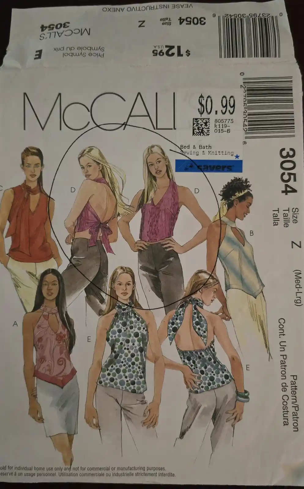 A McCall's sewing pattern package for tops, featuring illustrations of seven women modeling different styles, with a black…