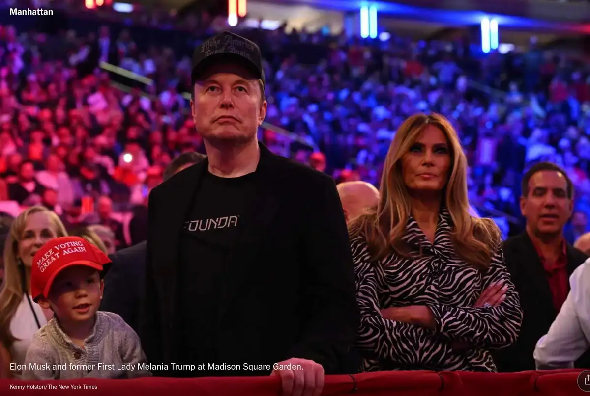 A photo shows Elon Musk wearing a 'Make America Great Again' cap and a black t-shirt with 'FOUND' visible, seated next to…