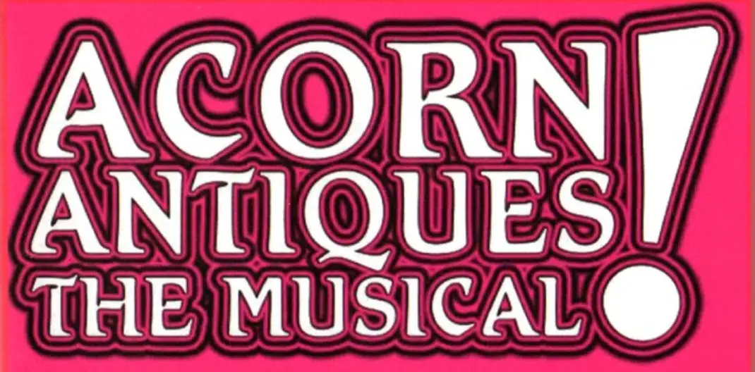 A bright pink background features bold, white, stylized text with black outlines reading 'ACORN ANTIQUES! THE MUSICAL!' The…