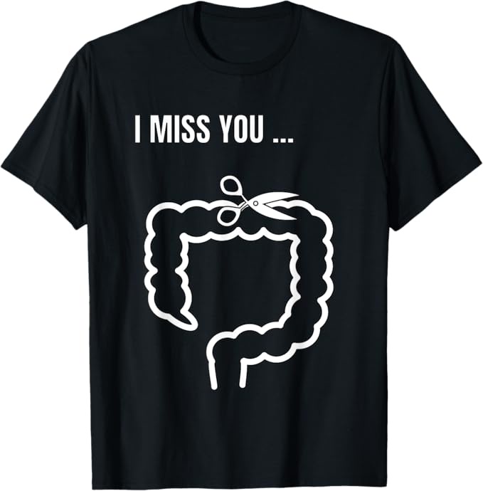 A black t-shirt features white text reading 'I MISS YOU ...' above a white outline of a human colon. A pair of scissors is…