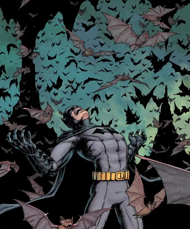 Batman stands in a dark, bat-filled cave with his arms outstretched and mouth open in a scream, surrounded by hundreds of…