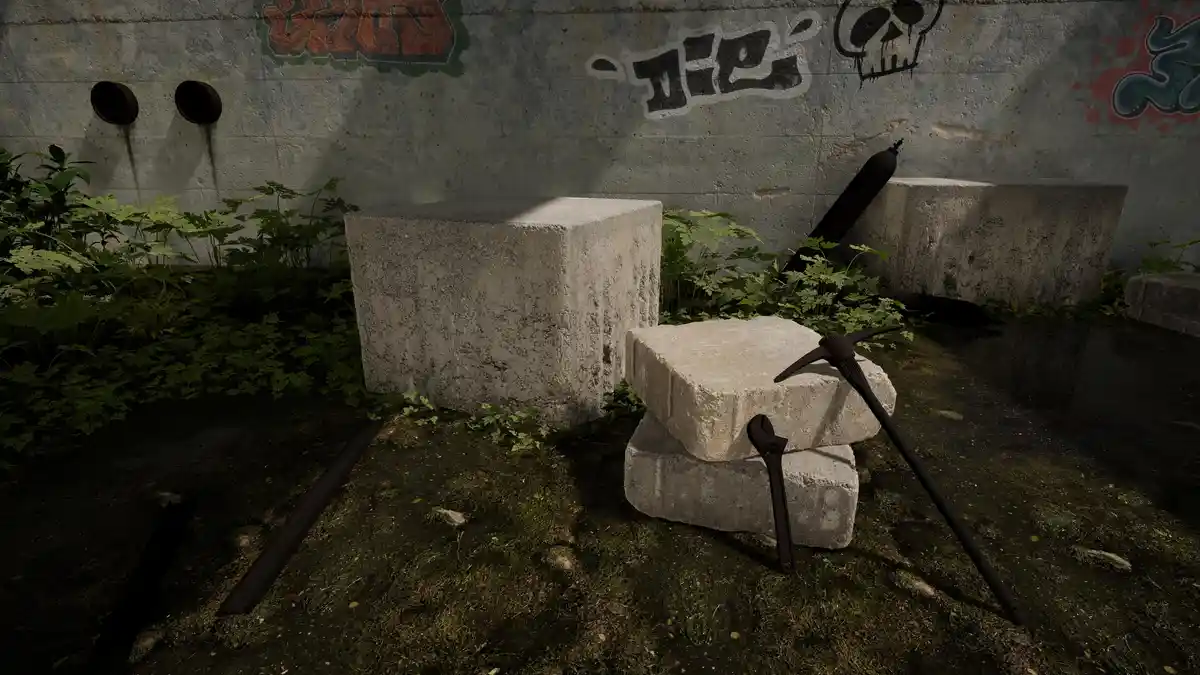 A dimly lit, overgrown concrete area with graffiti-covered walls, featuring stacked concrete blocks, a pickaxe, a wrench…
