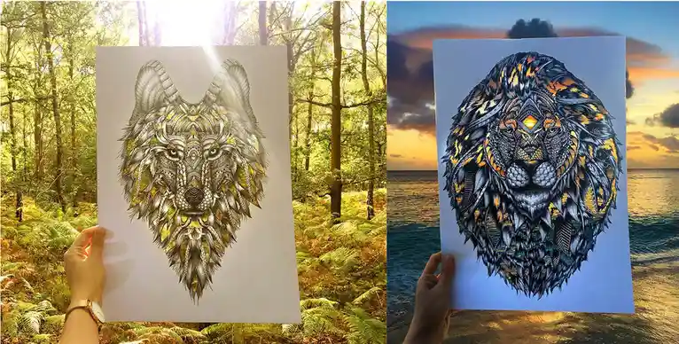 Two side-by-side images show a hand holding a detailed, ornate drawing of a wolf in a sunlit forest and a lion at sunset…