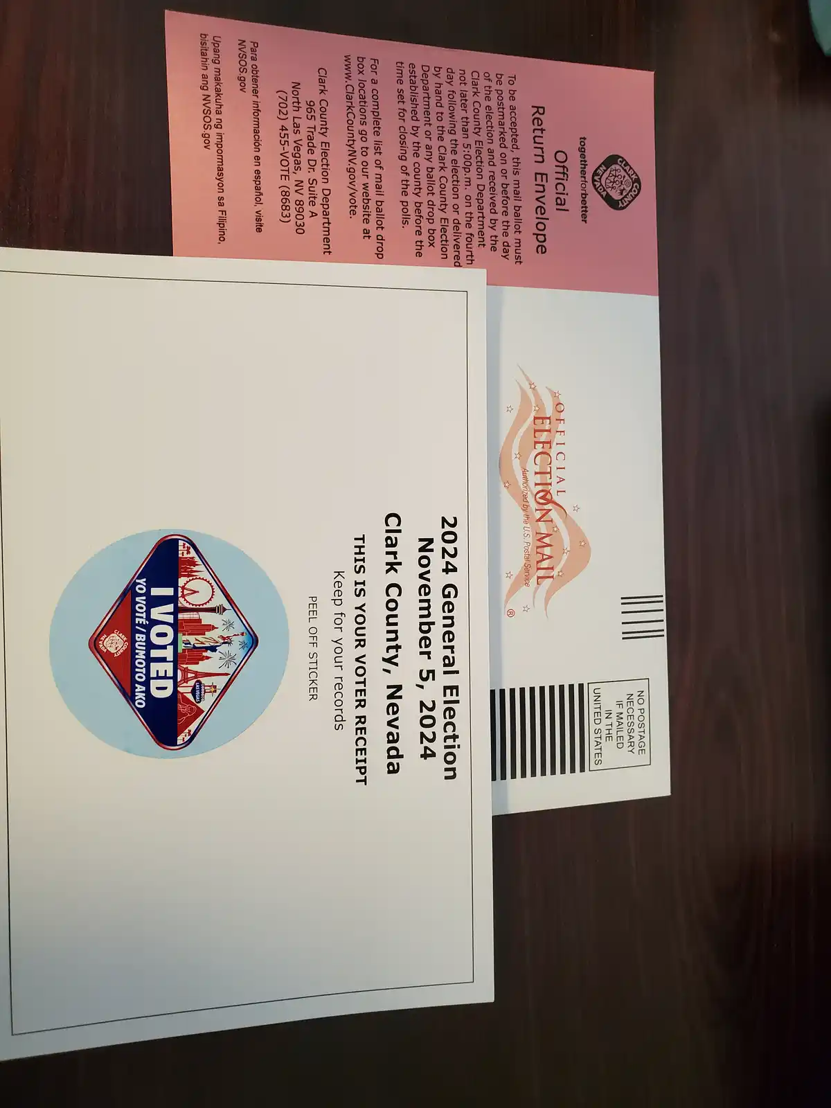 An official Clark County, Nevada 2024 General Election voter receipt with an 'I VOTED' sticker is shown next to its…