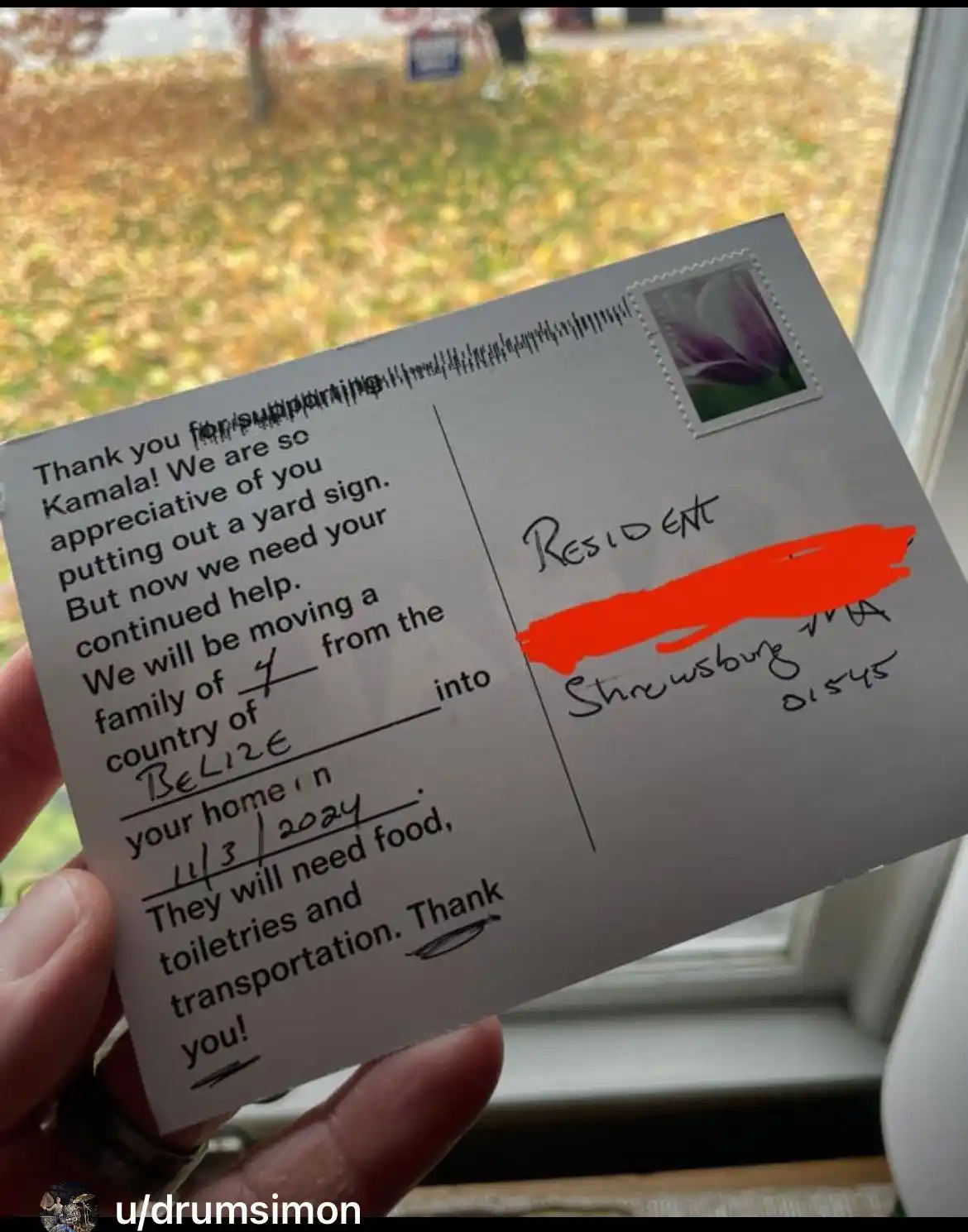 A person holds a postcard with a printed message thanking someone for supporting Kamala Harris by putting up a yard sign…