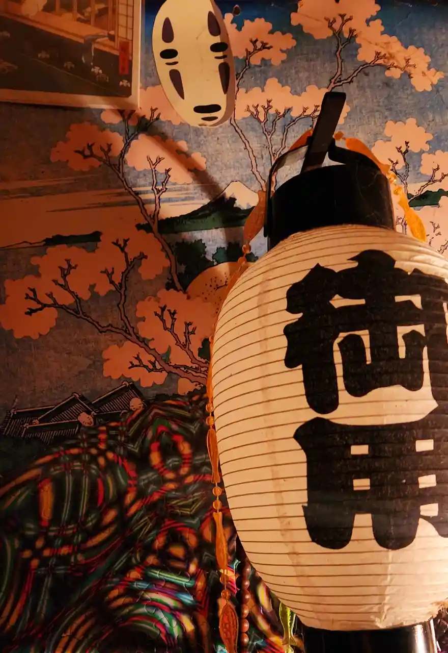 A close-up photo shows a white Japanese paper lantern with the black kanji characters '街角' (gai-kan, meaning 'street…