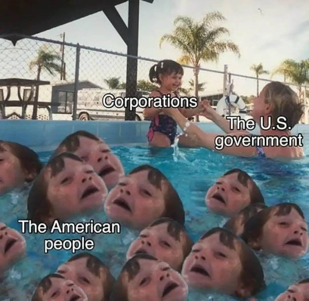 A photo shows a small child labeled 'Corporations' being held by an adult labeled 'The U.S. government' while numerous other…