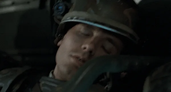 A six-panel image sequence shows a soldier in a helmet sleeping in the cockpit of a vehicle, with his eyes closed and mouth…