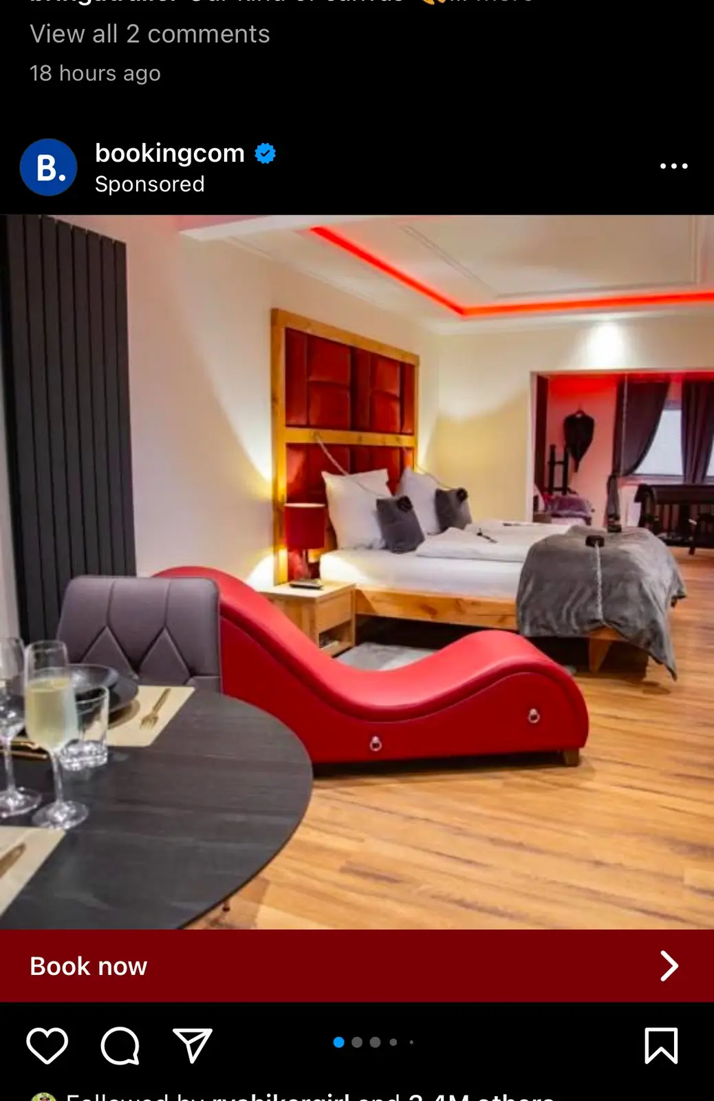 A promotional image from Booking.com shows a modern hotel room with a large bed, red ambient lighting, and a red chaise…