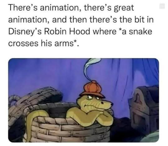 A still from Disney's Robin Hood shows a yellow snake wearing a small orange hat, lounging in a woven basket with its arms…