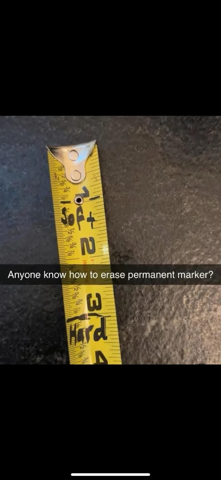 A yellow measuring tape lies on a dark, textured surface with the words 'Soft' and 'Hard' written in black permanent marker…