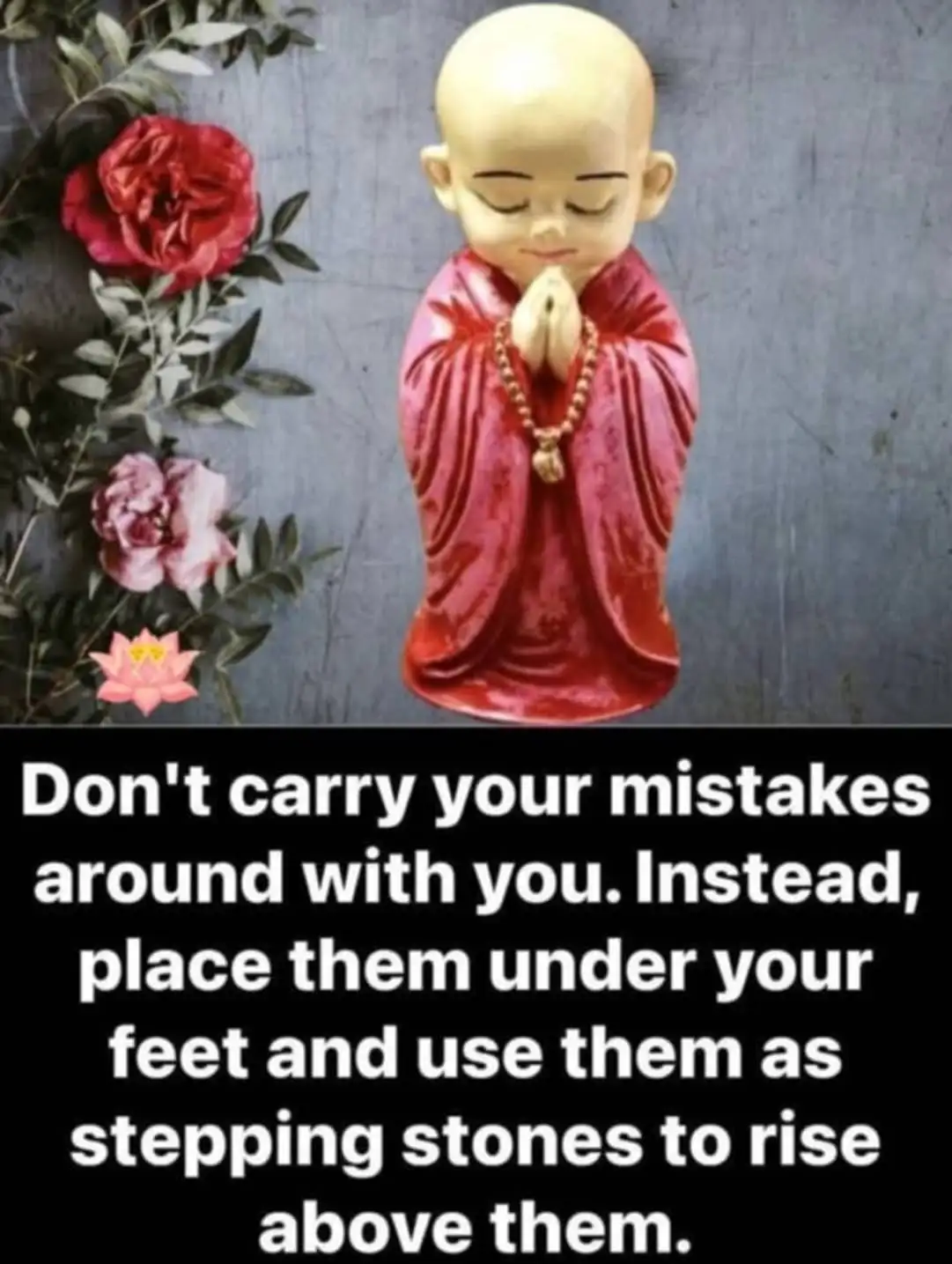 A small, bald, serene figurine of a monk in red robes with hands clasped in prayer, adorned with a beaded necklace, stands…