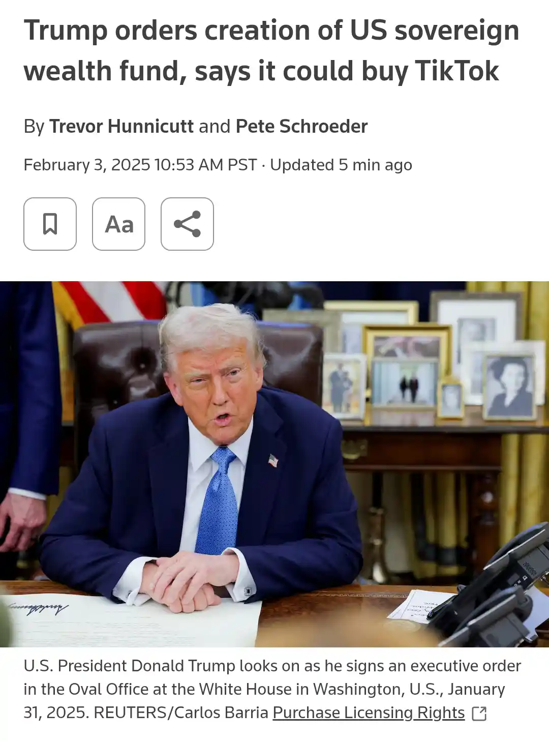 A screenshot of a news article header showing a photo of Donald Trump seated at a desk in the Oval Office, signing an…