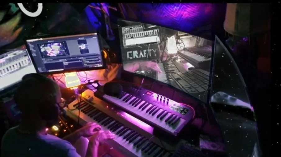 A person sits at a keyboard in a dimly lit, purple-lit room with multiple monitors displaying music production software and…