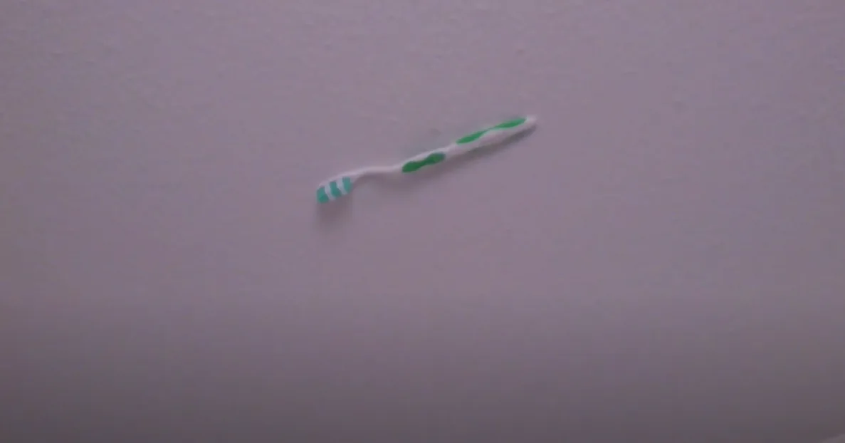 Toothbrush Suspended in Midair: A Quirky Ceiling Art