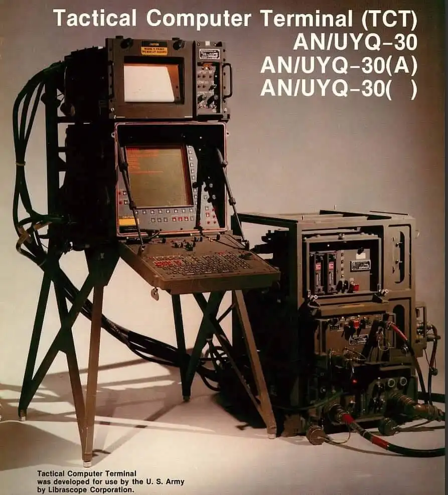 An image of a large, rugged, military-grade Tactical Computer Terminal (TCT) AN/UYQ-30 with multiple screens, a keyboard…