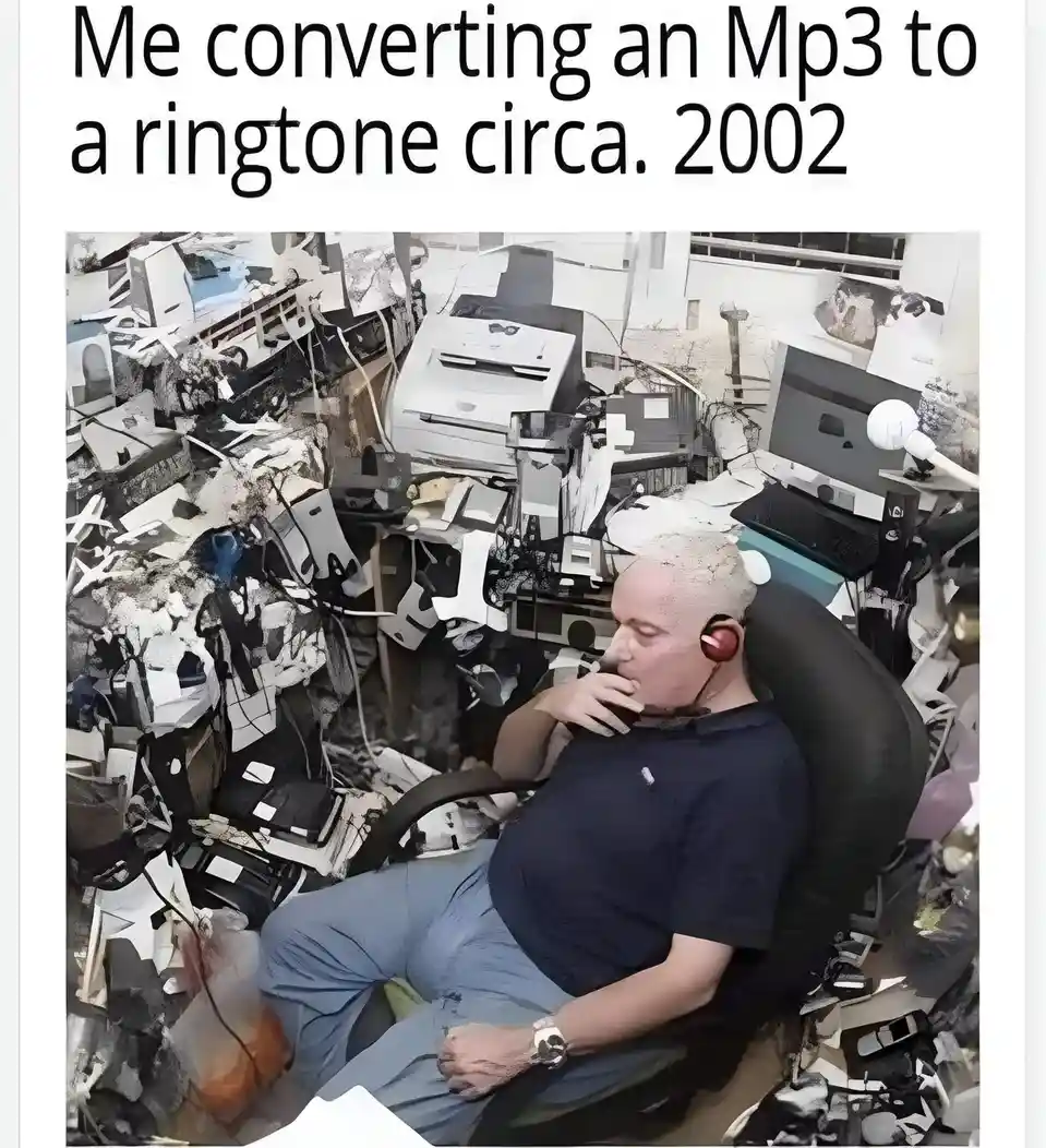 A man sits in a black office chair, wearing red headphones and looking exhausted, surrounded by a chaotic collage of broken…