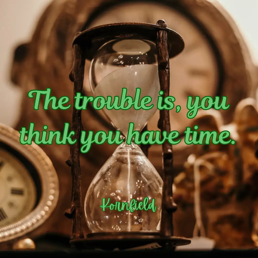 An image of an hourglass with sand flowing, set against a warm-toned background featuring a clock and other decorative…