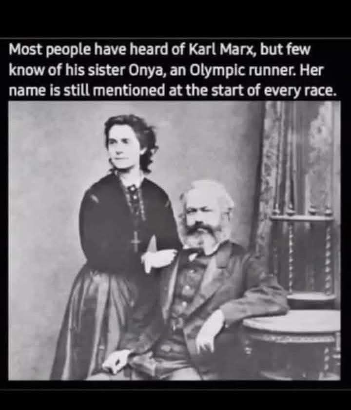 A vintage black-and-white photograph shows Karl Marx seated, with his sister Onya standing beside him, both dressed in…