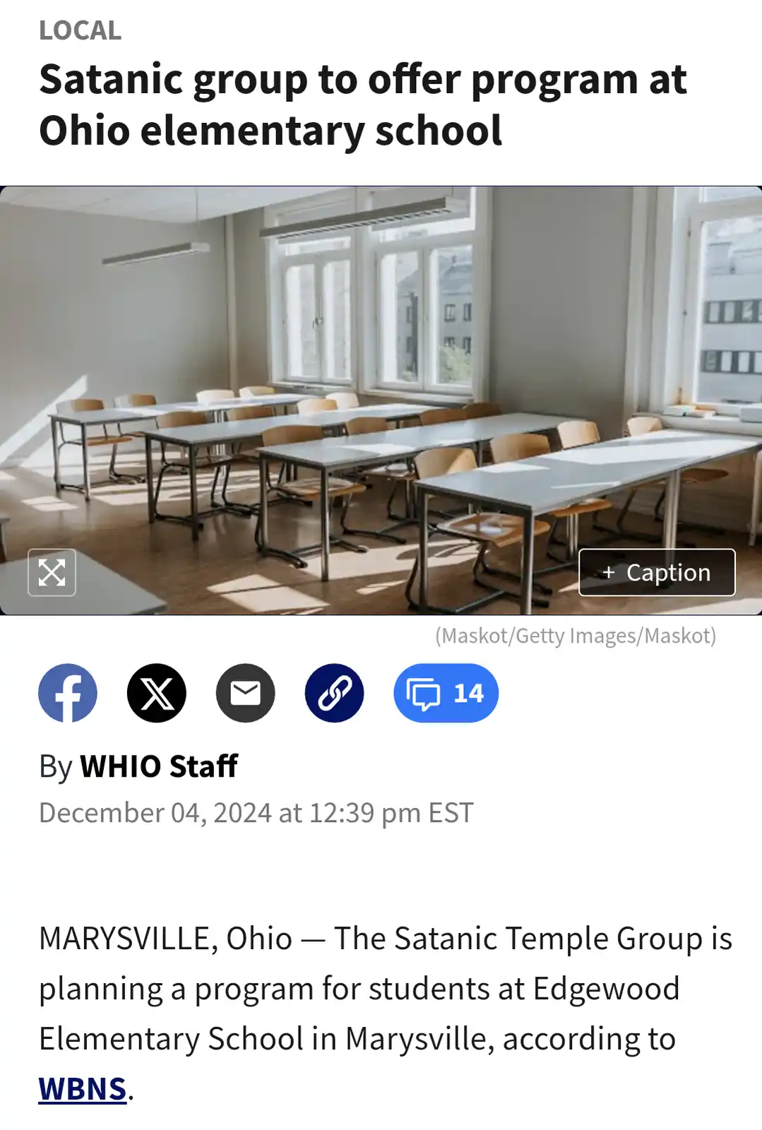 An empty elementary school classroom with rows of desks and chairs under bright windows, overlaid with a news headline that…