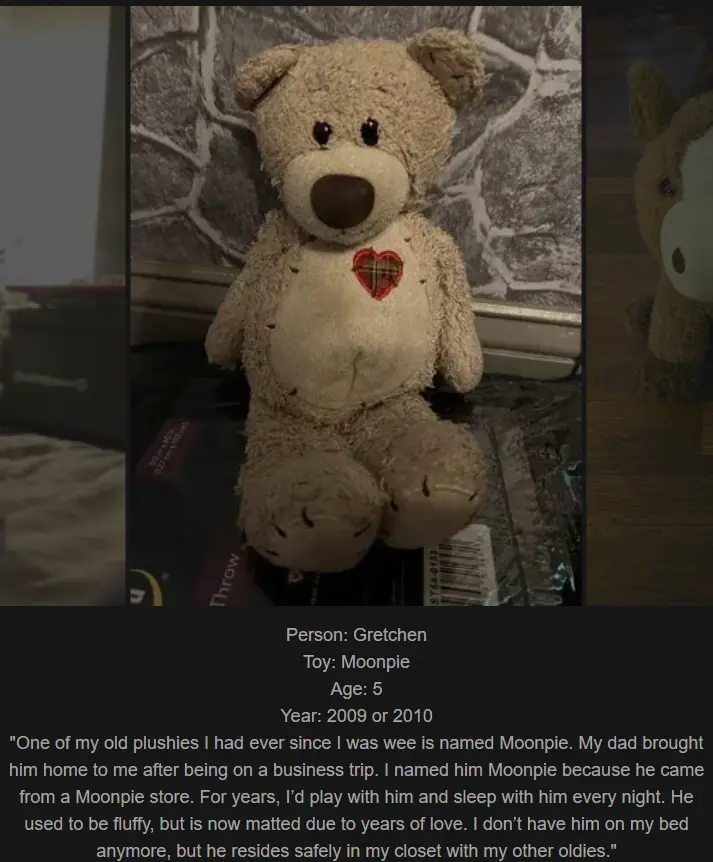 A worn, beige teddy bear with a red plaid heart on its chest sits on a surface against a stone-patterned wall. Overlaid text…