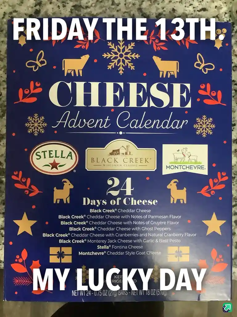 A blue cheese advent calendar box with festive red and gold decorations, featuring logos for Stella, Black Creek, and…