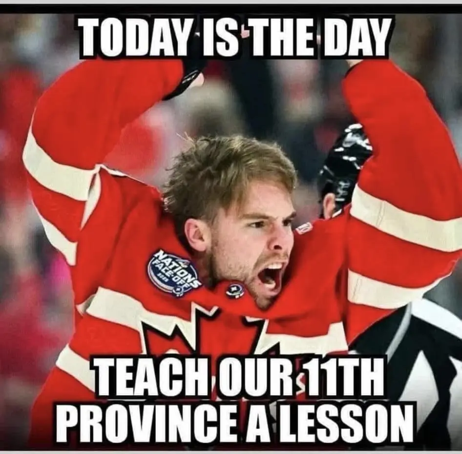 A hockey player in a red Canadian jersey with a maple leaf and 'Nations Face-Off' patch raises his arms in triumph, mouth…