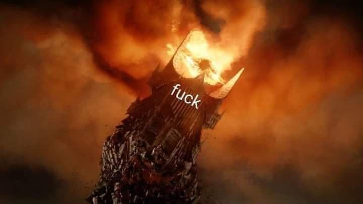 A dark, crumbling castle or tower is shown collapsing and burning intensely against a fiery orange and black sky. The word…