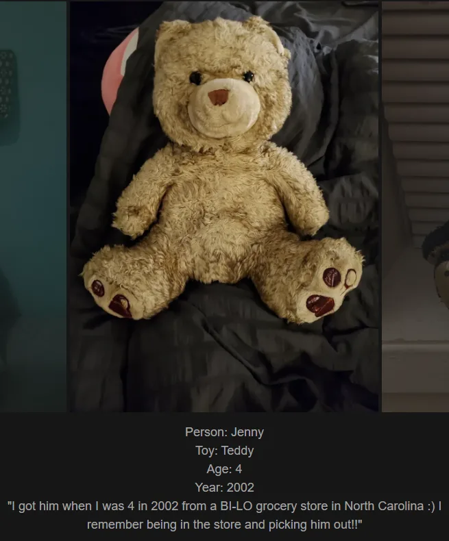 A worn, light-brown teddy bear with dark button eyes and a faded nose sits on dark bedding. Text overlaid at the bottom…