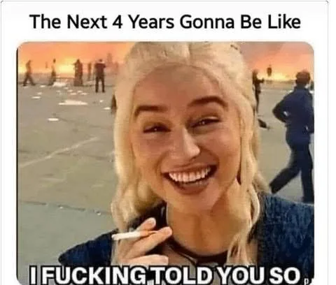 A woman with blonde hair and a wide, triumphant smile holds a cigarette, set against a backdrop of a fiery, chaotic scene…