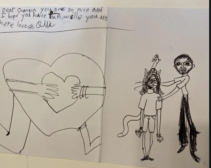 A hand-drawn, two-page children's book spread shows a child's heartfelt note to 'Grampa' on the left page, with a simple…
