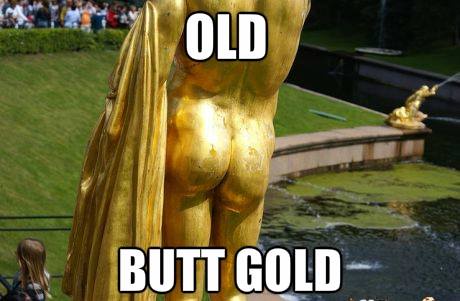 A close-up photo of a golden statue's rear end, with the words 'OLD' above and 'BUTT GOLD' below. The statue is partially…