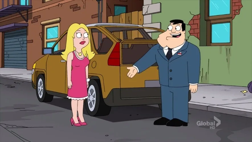 A cartoon man in a blue suit stands beside a yellow SUV, gesturing toward a blonde woman in a pink dress who looks shocked…