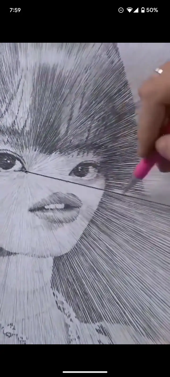 A close-up shows a hand holding a pink pen, drawing a portrait using radiating lines to create shading and form. The…
