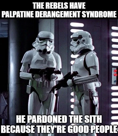Two stormtroopers stand facing each other in a dimly lit corridor with vertical light panels on the wall behind them. The…