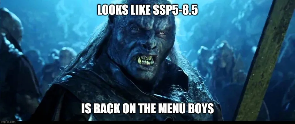 A menacing blue-skinned orc with sharp teeth and long hair, from a fantasy movie, stares intensely. White bold text overlaid…