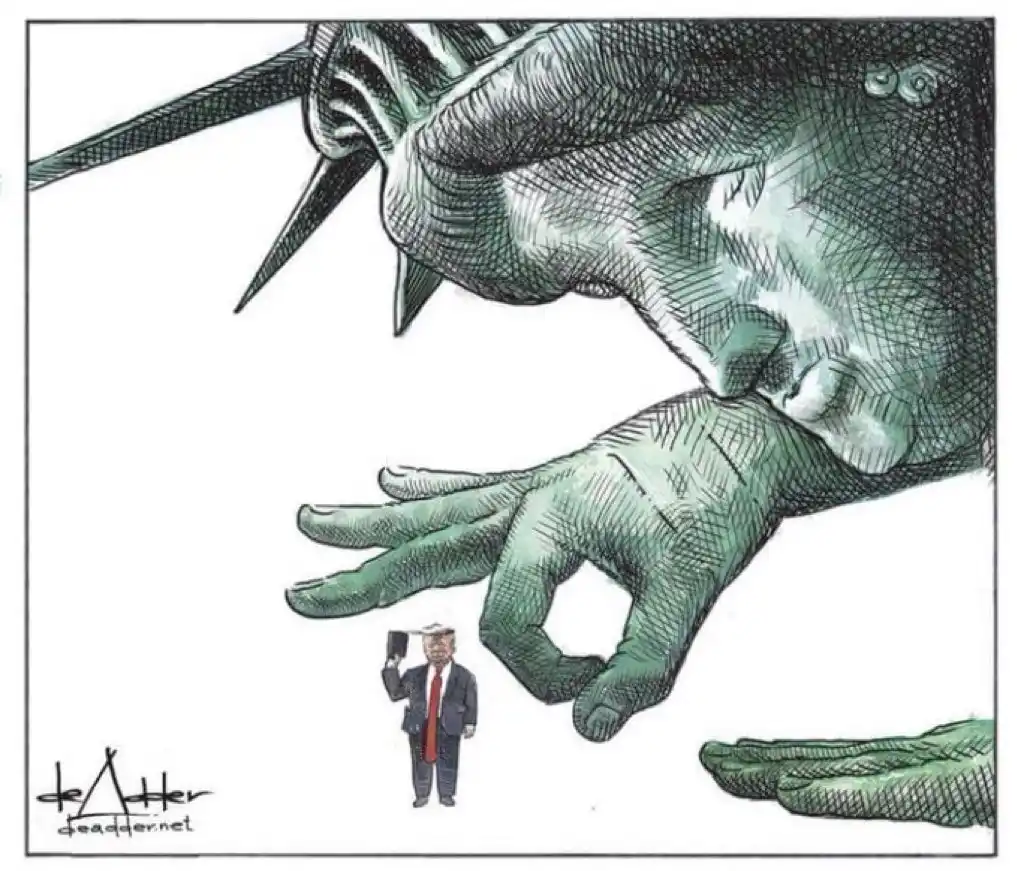 A cartoon depicts a giant, green Statue of Liberty looming over a tiny Donald Trump figure who is holding up a phone. The…