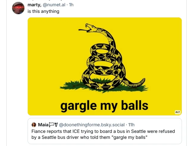 A yellow background features a black coiled snake with its mouth open, resembling the Gadsden flag. Below the snake, the…