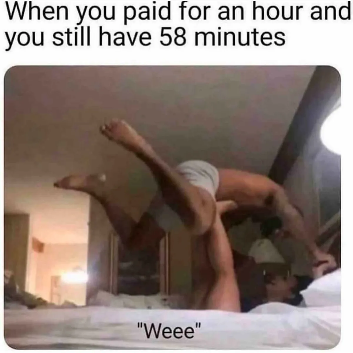 A person is lying on a bed, legs kicked up in the air, while another person is underneath them. The text at the top reads…