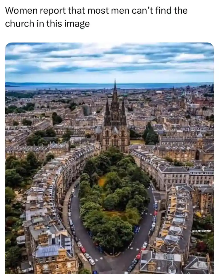 An aerial photo shows a cityscape with a large, prominent church with multiple spires at its center, surrounded by dense…