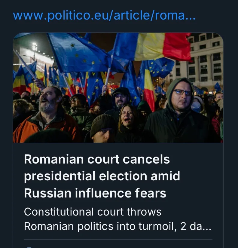 A screenshot of a news article from Politico EU shows a crowd of people at a nighttime protest, waving Romanian and European…